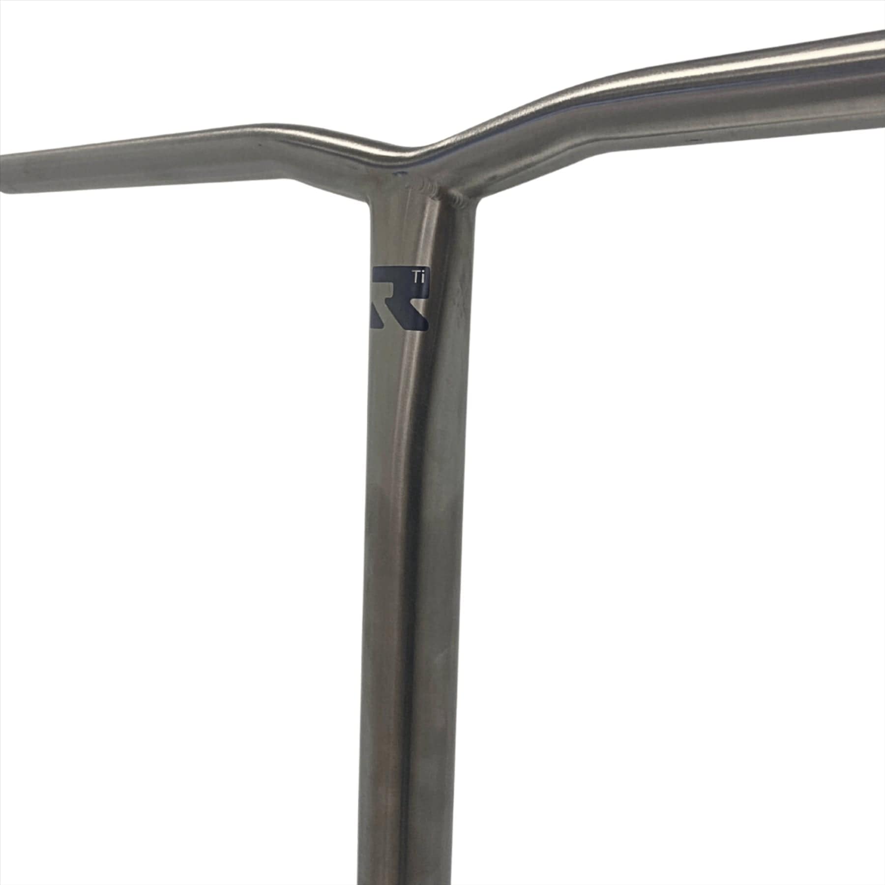 A close-up showcases the Root Industries AIR Titanium Oversized HIC Stunt Scooter Bars in their raw finish, elegantly forming a T-shaped handlebar against a white background. These lightweight handlebars feature a smooth, shiny surface that beautifully reflects light. Measuring 660mm x 600mm, they epitomize sleek design and engineering.