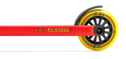 Close-up of a red Slamm Classic Mini Complete Stunt Scooter, designed for freestyle scootering with "Slamm" printed on the side of the deck. This entry-level scooter features a vibrant yellow and black wheel.