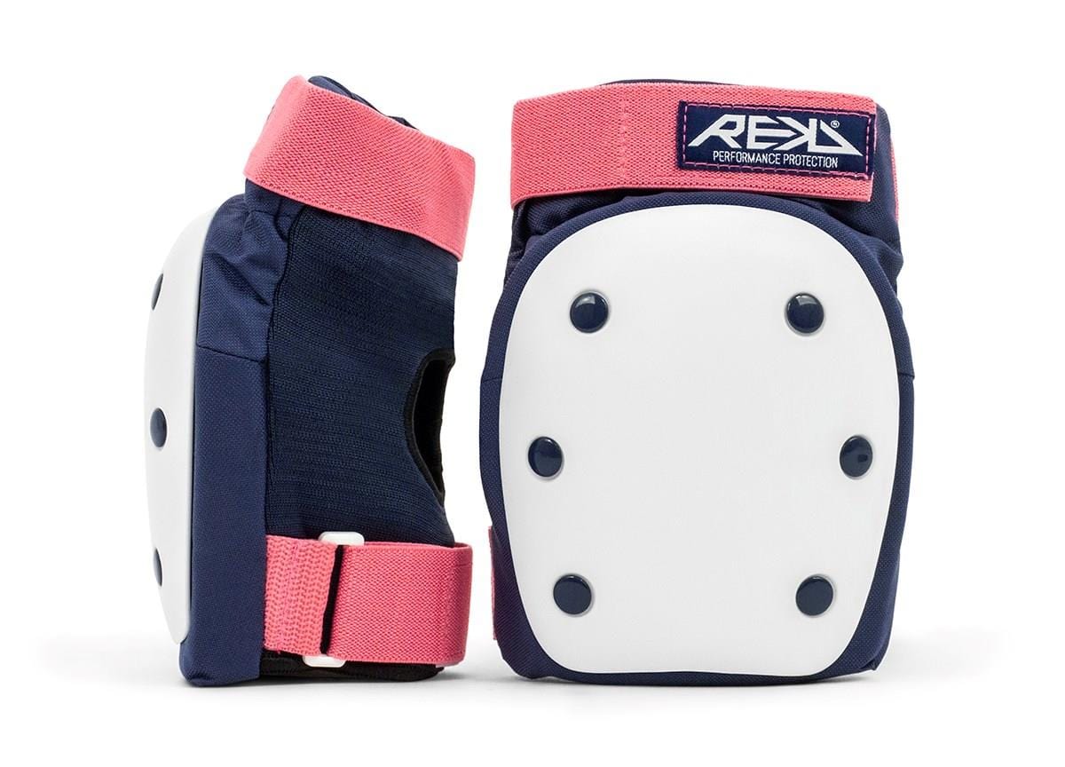 The sentence can be rewritten as: The REKD Heavy Duty Triple Skate Protection Pad Set in blue and pink is showcased, featuring white protective front plates with black rivets. This design ensures safety during activities like roller skating or skateboarding, and the addition of impact caps offers enhanced protection for adventurous skaters.