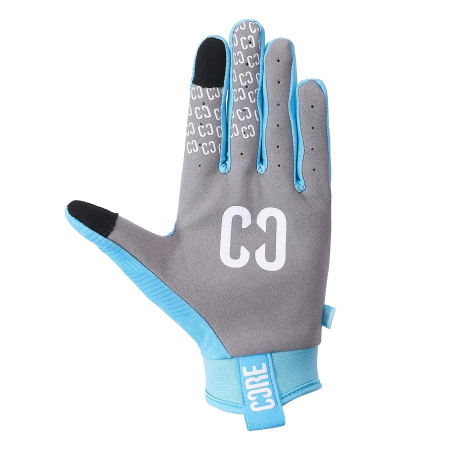 This single teal glove, the CORE Aero Skate Protection Glove by CORE, showcases a large white "C" and "O" on the back with "CORE" displayed on the wrist strap. The inner fingers feature small white "CO" patterns for enhanced grip. Perfect for performance sports or riding gloves, they are also designed to be touch screen friendly.