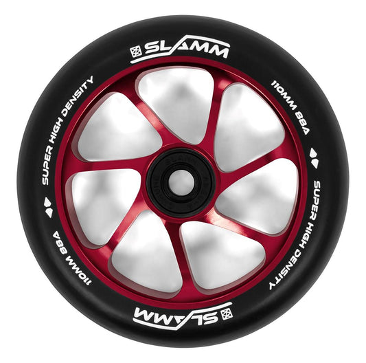 Close-up of the Slamm Team 110mm Stunt Scooter Wheel - Red, showcasing its black and red design with six red spokes and a premium-grade aluminum core. The black tire features white text that reads "Super High Density 110mm 88A" along with the brand name "Slamm," while the center hub maintains a sleek black appearance.