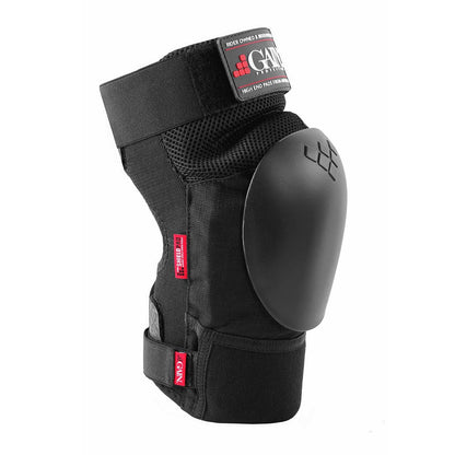 The GAIN Protection The Shield Pro Knee Skate Pads in black feature a durable hard plastic cap and adjustable straps, making them ideal for sports and freestyle scootering. Their mesh and fabric design provides ventilation and flexibility, while red tags with white text stylishly adorn the sides for an added touch of flair.