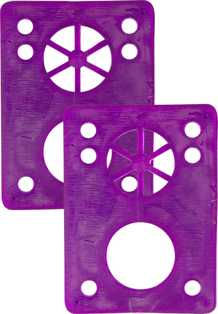 The Essentials Skateboard Riser Pads - 1/8" Purple from Essentials consist of two slightly translucent purple rectangular plastic pieces with circular cutouts and holes. They feature a star-like design in the center of each pad, and when aligned vertically, they increase ground clearance to help prevent wheel bite.