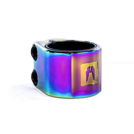 The Ethic Valkyria 2 Bolt Oversized Stunt Scooter Clamp in Neochrome is made from 6061 aluminum and features a stylized logo. Its iridescent surface showcases a captivating gradient with vibrant shades of purple, blue, and green.