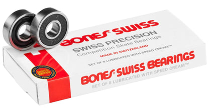 The Bones Swiss Skateboard Bearings - 8 Pack, by Bones, features a high-end design with two bearings on top. The white box with red accents indicates it holds 8 Skate Rated bearings, lubricated with Speed Cream and expertly crafted in Switzerland.