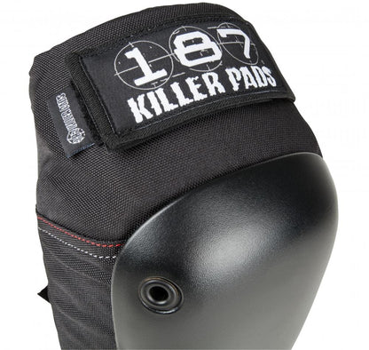 The 187 Fly Knee Skate Protection Pads in black, by the brand 187, feature a hard shell suitable for action sports and display the white text "187 Killer Pads" on the fabric strap.