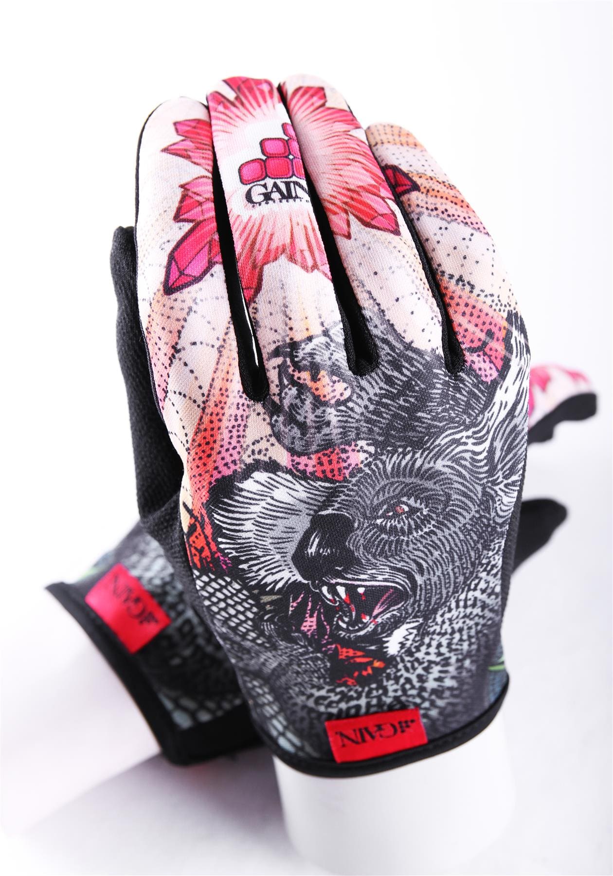 Introducing the GAIN Protection Resistance Skate Gloves - Dropbear: These vibrant gloves feature a striking floral and animal design with a roaring bear and vivid red flowers. Crafted from durable ARMORTEX fabric, they have sleek black palms and a distinctive GAIN logo on the wrist cuff. They're elegantly showcased on a white mannequin hand against a minimalist white background.