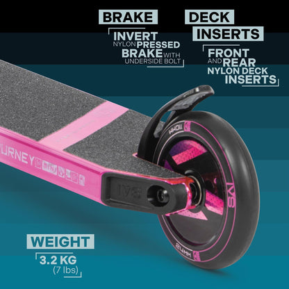 A close-up of the Invert Supreme Journey 1+ Mini Jamie Hull Stunt Scooter in Tri Electro Pink/Purple showcases its features: an invert nylon pressed brake with underside bolt, front and rear nylon deck inserts, and a wheel marked with "IVS" and "WHIP." This scooter is perfect for beginners at the skatepark, weighing just 3.2 kg (7 lbs).