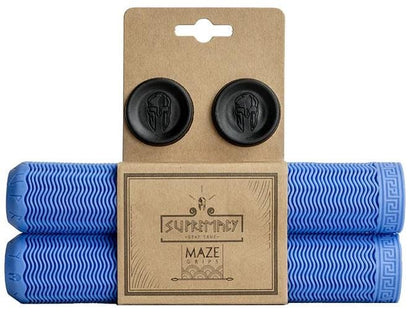 The image features a package of Supremacy Maze Blue Stunt Scooter Grips - 180mm, crafted for stunt scooter enthusiasts. The grips exhibit a zigzag pattern, decorative black end caps, and are made from durable materials. The packaging prominently displays the Supremacy logo and product name, specifically designed for pro riders.