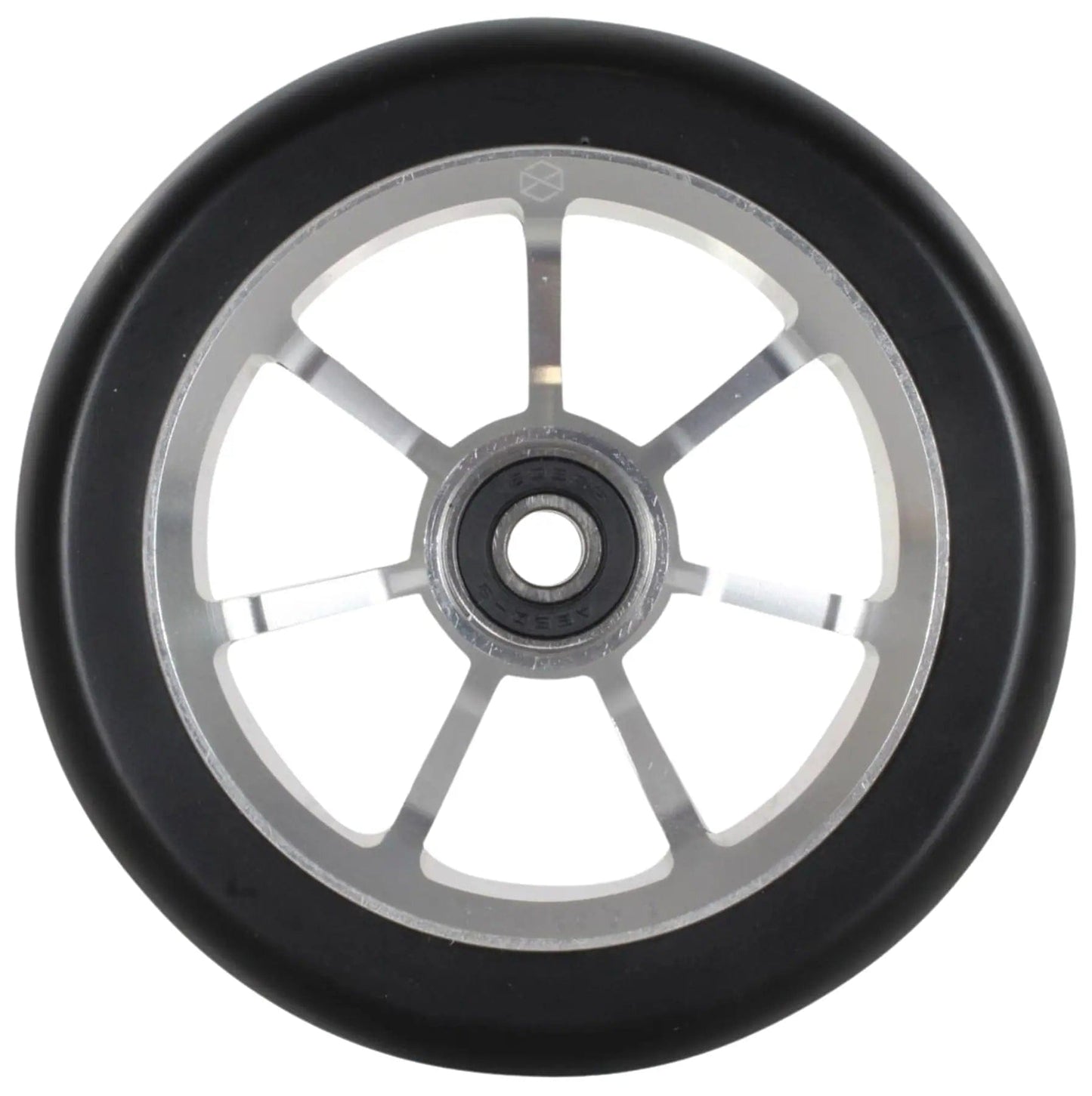 The Native Stem 110mm Stunt Scooter Wheel in Chrome Silver features a detailed close-up of its design, highlighting a black rubber outer rim paired with a metallic inner rim. The wheel is embellished with an intricate circular pattern and six evenly spaced spokes that extend from the central hub, underscoring the durability needed for performing remarkable stunts.