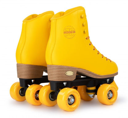 The Rookie Classic 78 Quad Roller Skates in vibrant yellow feature a logo on the side, brown soles, bright wheels, and lace to the top. Vegan-friendly and presented together in a stunning design.