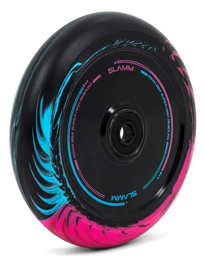 The Slamm Swirl 110mm Stunt Scooter Wheel in black, blue, and pink showcases a circular design featuring the Duo-Tone Split Swirl Effect Urethane. Its "SLAMM" styled rim encases ABEC-9 Chrome rubber shielded bearings for a smooth riding experience.