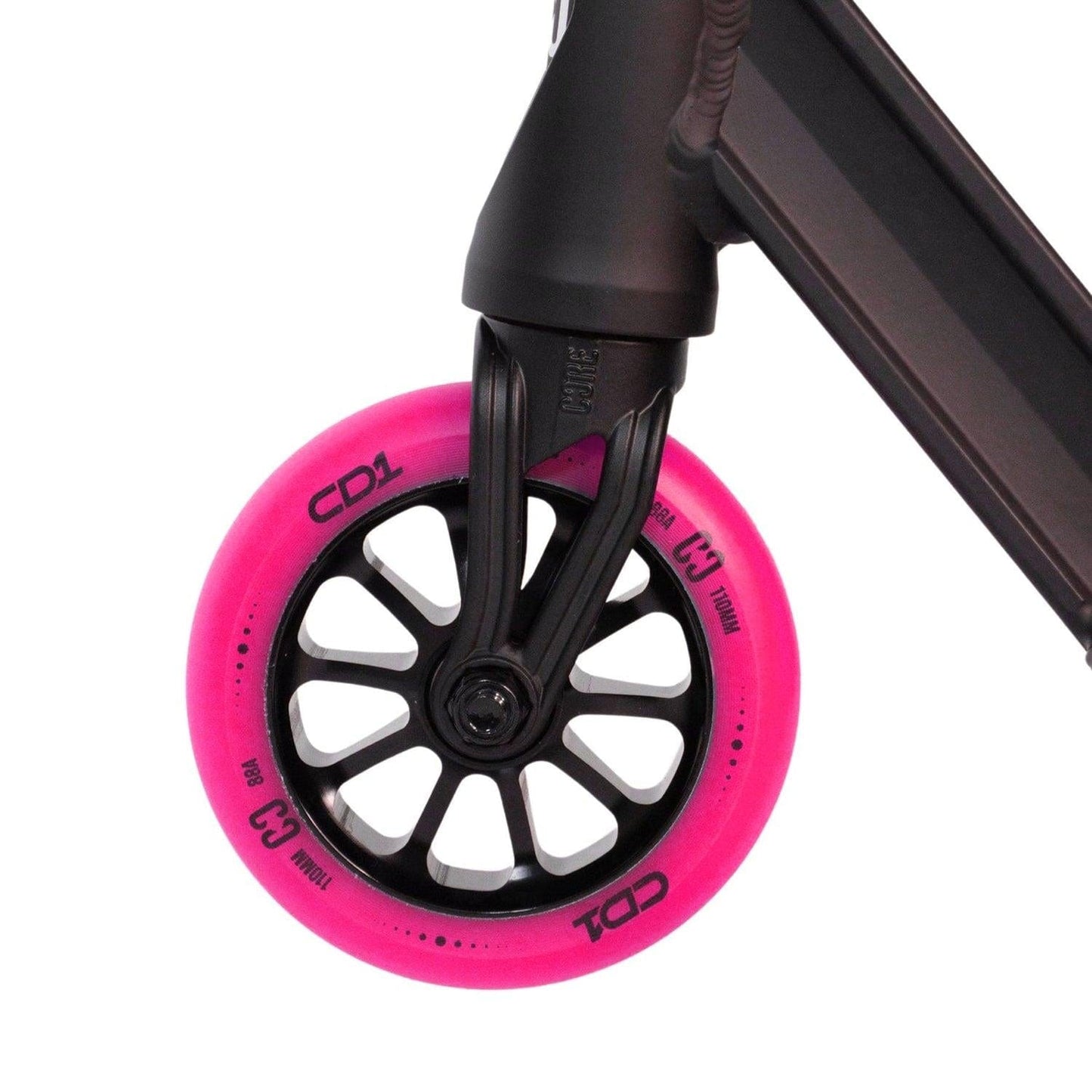 Close-up of a scooter wheel with vibrant pink tires, ideal for both stunt scooter enthusiasts and beginner riders. Attached to a sleek black frame, the tire features the "CORE CD1" label and is sized at 100mm. The spoke design seamlessly enhances the sturdy aluminum deck of the CORE CD1 Complete Stunt Scooter - Pink / Black.