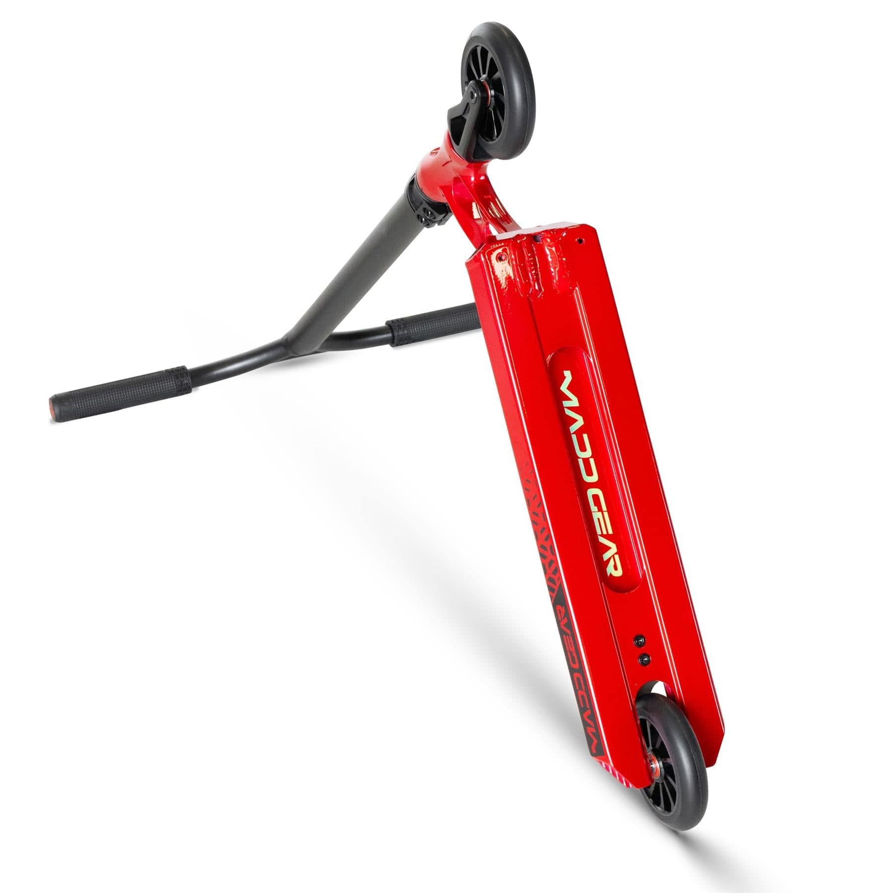 The Madd Gear VX Origin III 450 Complete Stunt Scooter in Blood Red stands upright on one wheel, showcasing its sleek design. Equipped with a T-bar handle and black grips, it's ideal for young shredders ready to ride.