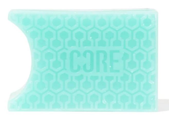 Featuring a honeycomb pattern and a rectangular shape in bubblegum teal, the CORE Epic Skate Wax proudly displays the word "CORE" on its surface. A semi-circular cutout on one corner suggests a design feature tailored for skaters.