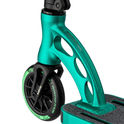 A close-up of the front wheel and fork of the Madd Gear MGP VX Origin Team Edition Complete Stunt Scooter in Petrol/Cyan, highlighting a sleek, curved design with three circular cutouts. The lightweight wheel features a black rim with visible Madd Gear branding on the side. The deck is equipped with a textured grip surface to enhance performance and durability.