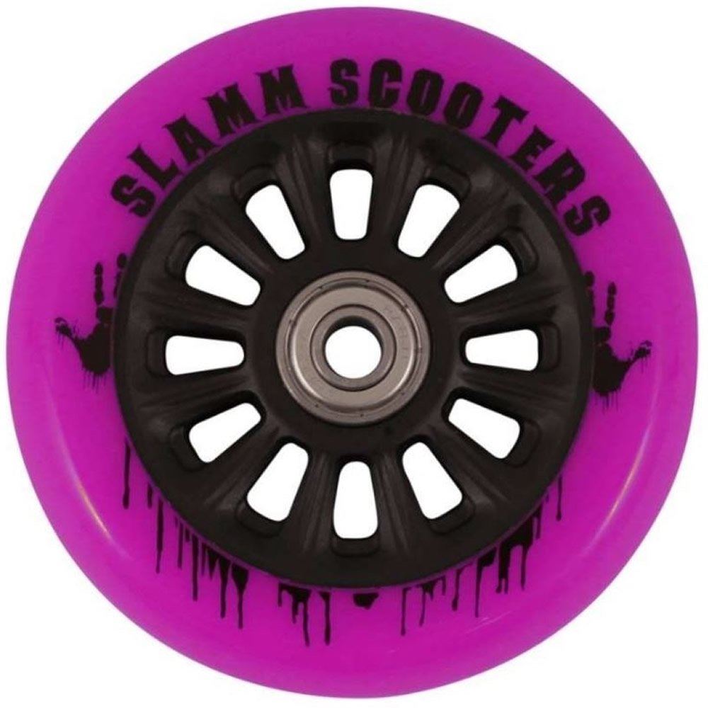 A close-up of the Slamm Nylon Core 100mm Scooter Wheel in vibrant pink with a black hub, featuring "Slamm Scooters" printed around the rim. The polyurethane composite wheel is adorned with an artistic design showcasing black paint drips, and it is equipped with ABEC 9 Chrome Bearings for smooth rides.