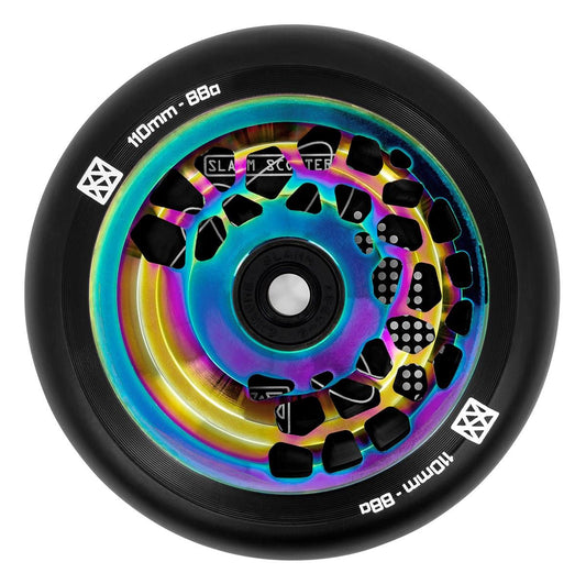 A vibrant Slamm Split Core 110mm stunt scooter wheel boasts a black outer tire and an inner core with a stunning neochrome finish, adorned with geometric cutouts. The wheel features white text that reads "110mm Split Core - 88a.