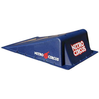 Introducing the Nitro Circus Mini Launch Ramp, a blue ramp with logos adorning both its sides and top. It's ideal for skateboarders who love extreme sports, providing a smooth incline perfect for thrill-seekers.