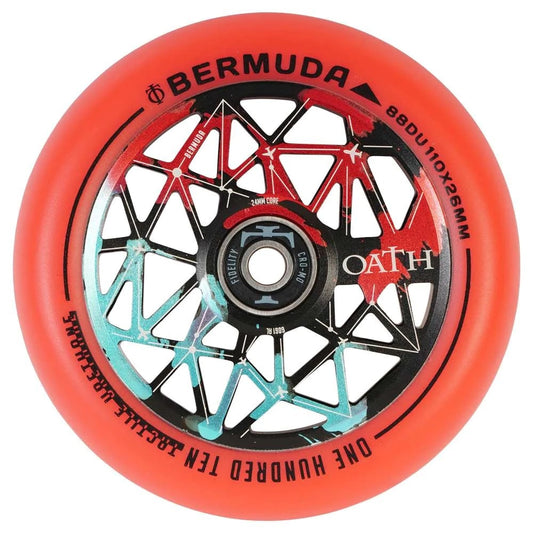 Close-up of the Oath Bermuda 110mm Stunt Scooter Wheel, featuring a vibrant red wheel with a geometric core design in black and teal. The sleek look is complemented by the text "88DU, 110x26mm, OATH" and "ONE HUNDRED TEAM SERIES," along with corrosion resistance and Oath Fidelity bearings for enhanced performance.