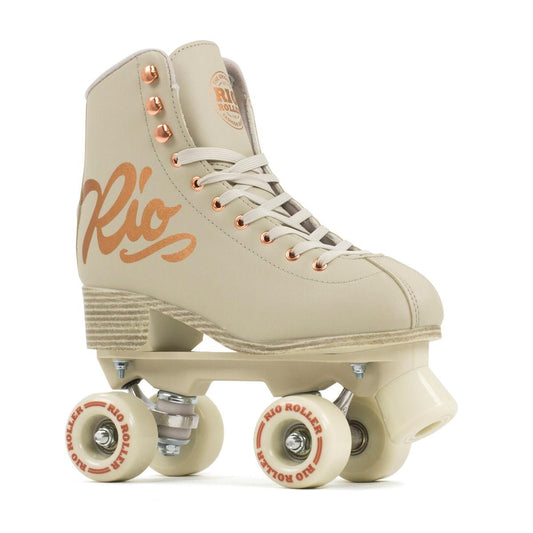 The Rio Roller Rose Quad Roller Skates - Rose Cream from Rio Roller showcase a high ankle boot design in beige, embellished with rose gold accents and the elegant "Rio" script on the side. Featuring four cream-colored wheels and a wooden heel, these skates perfectly blend elegance with retro style.