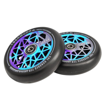 The Oath Bermuda 110mm Stunt Scooter Wheels, in a striking blue, teal, and purple color scheme, boast a geometric hub design with black outer tires. Enhanced by high-grade Oath Fidelity bearings for superior performance, the wheels also prominently display the Oath brand on the rims for added style and dependability.