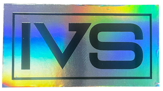 The image features the Invert Supreme Logo Sticker, a product by Invert, displaying bold black "IVS" letters against a rectangular holographic background that reveals a vibrant rainbow of colors.