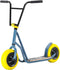 The Rocker Rolla Big Wheel Complete Scooter features a striking grey design, combined with large yellow tires and a wide handlebar, offering a mini BMX-style perfect for stunt enthusiasts.