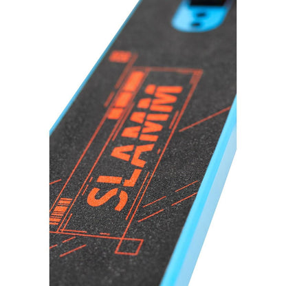 Close-up of the Slamm Classic Mini Complete Stunt Scooter - Blue deck, featuring a gritty black surface and the brand name "SLAMM" in bold orange letters. Ideal for freestyle scootering, this entry-level stunt scooter's edges are accented in light blue.