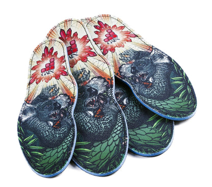 The GAIN Protection SoleBros Insoles - Dropbear from GAIN offer vibrant, shock-absorbing insoles adorned with a gorilla print among tropical leaves. They feature a red floral motif and a stylized logo at the heel, making them ideal for freestyle scooter riders who value both style and impact energy absorption.