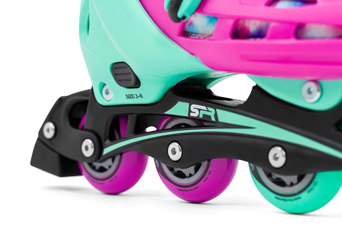 Close-up view of the vibrant SFR Cyclone II Adjustable Inline Skate in a tie-dye design, highlighting the green and pink boot with black and pink wheels. Perfect for beginner skaters, it includes an adjustable sizing system labeled 3-6 to accommodate growing feet.