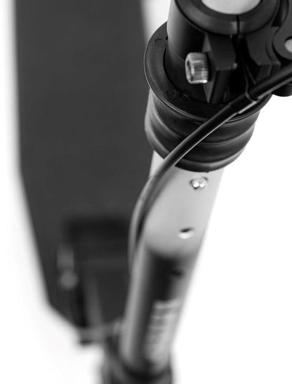 Close-up view of a black and silver Frenzy 205mm Air Zero Foldable Commuter Scooter, focusing on the handlebar area with visible cables and a latch mechanism. Its anodized finish gleams as it's positioned at an angle against a white background, boasting tubeless rubber tires for a smooth ride.