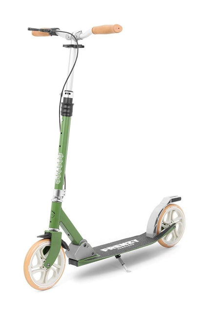 A Frenzy 205mm Dual Brake V4 Foldable Commuter Scooter in green, featuring large white wheels and tan handlebars, stands upright. It has a sturdy foldable frame, a deck with text on it, and a dual brake system visible over the rear wheel.