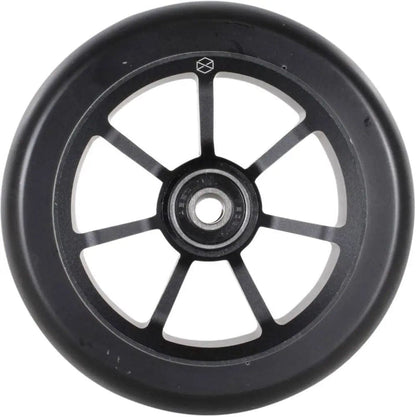 The Native Stem 110mm Stunt Scooter Wheel in black features a silver metal core with six spokes and a central bearing. Made from premium urethane, this high-quality construction is highlighted against a plain white background, emphasizing its sleek design and texture.