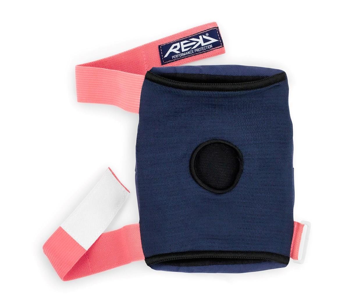 Introducing the REKD Heavy Duty Triple Skate Protection Pad Set in Blue and Pink, designed for optimal knee protection. This navy blue knee pad features a central circular cutout and is equipped with a pink adjustable strap secured by a Velcro fastener. The brand "REKD" is prominently displayed on a small rectangular label at the top.