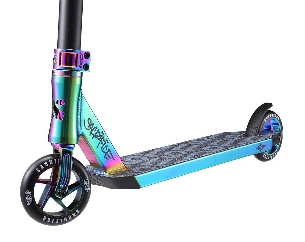 Introducing the Sacrifice Flyte 115 V2 Complete Stunt Scooter in Neochrome—a vibrant stunt scooter with a unique chrome finish. It features an IHC system, three wheels, a deck adorned with a graffiti-style design, and branded wheels. The scooter's eye-catching iridescent appearance gleams in striking teal and purple shades.