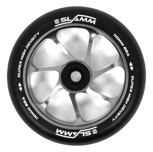 Close-up of a Slamm Team 110mm Stunt Scooter Wheel - Silver, showcasing its aluminum core with six spokes and a black rubber exterior. It features high-rebound PU construction, with the text on the wheel reading "Super High Density 110mm 88A.