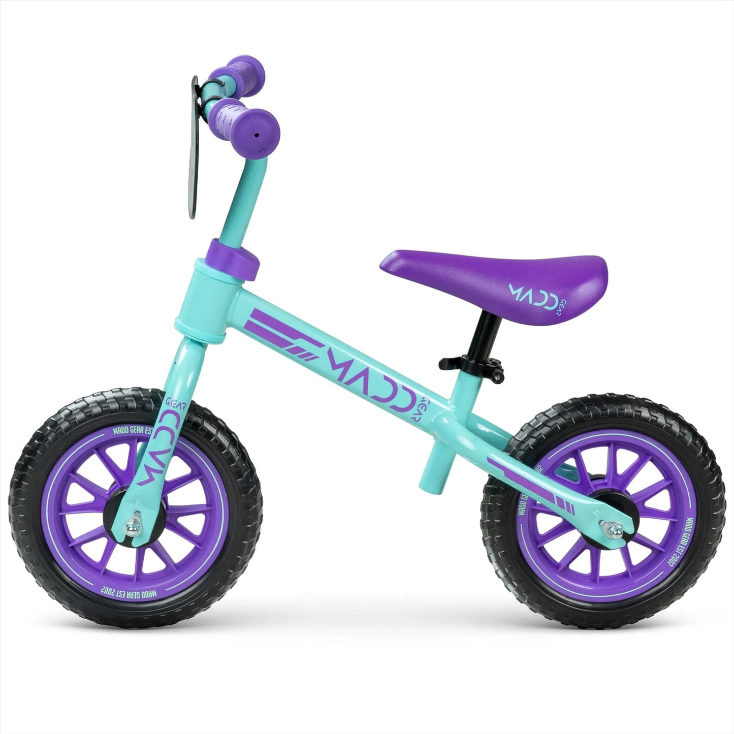 The Madd Gear My 1st BMX Balance Bike, available in teal and purple, is designed for kids aged 18 months to 4 years. It features black tires with a purple seat and handles. The MGP brand is prominently displayed on the frame and wheels.