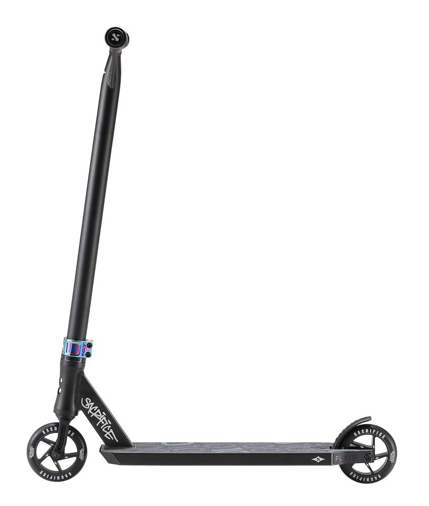 A sleekly designed Sacrifice Flyte 100 V2 Complete Stunt Scooter in black/neochrome, featuring a tall handlebar, two small wheels, and a sturdy triple concave deck. It boasts a minimalistic look with subtle branding on the deck and fork.