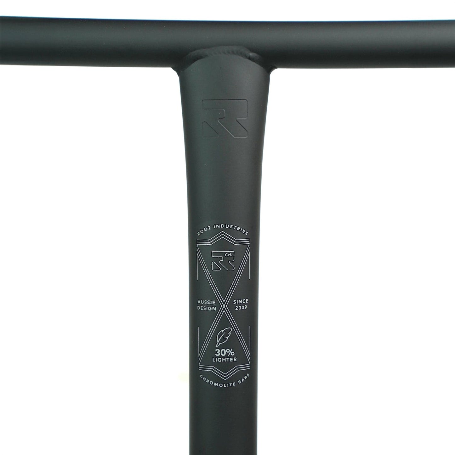 Close-up of the black handlebar on a Root Industries ChromoLite Steel Oversized HIC Stunt Scooter T-Bars, featuring an 'R' logo and text: "Root Industries," "Aussie Design," "Since 2009." These bars are 30% lighter with a matte finish that enhances the sleek design and underscores the durability of chromoly construction.