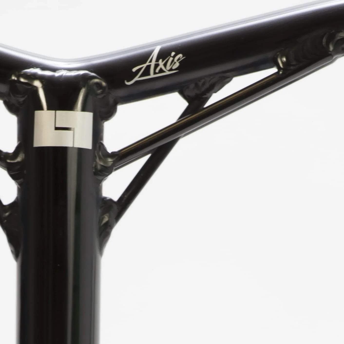 A close-up of a black frame featuring the word "Axis" emphasizes the welds and design details, showcasing the craftsmanship and robust support gussets found in the Logic Axis V2 Aluminium Oversized IHC Stunt Scooter Bars - Black 610mm x 610mm from Logic, enhancing your riding experience.