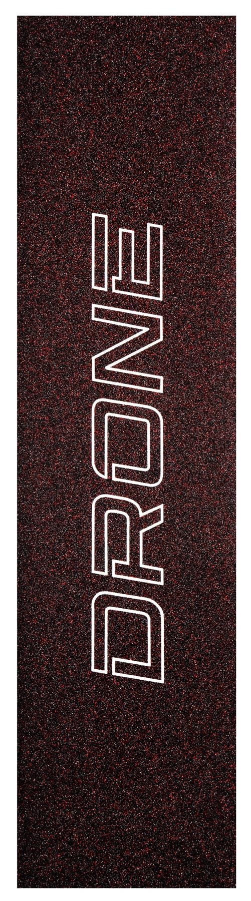 Close-up of the Drone Prism Glitter Stunt Scooter Griptape - Red, featuring bold white letters vertically aligned on a dark, speckled background. The texture resembles fine silica grit for enhanced traction and style.