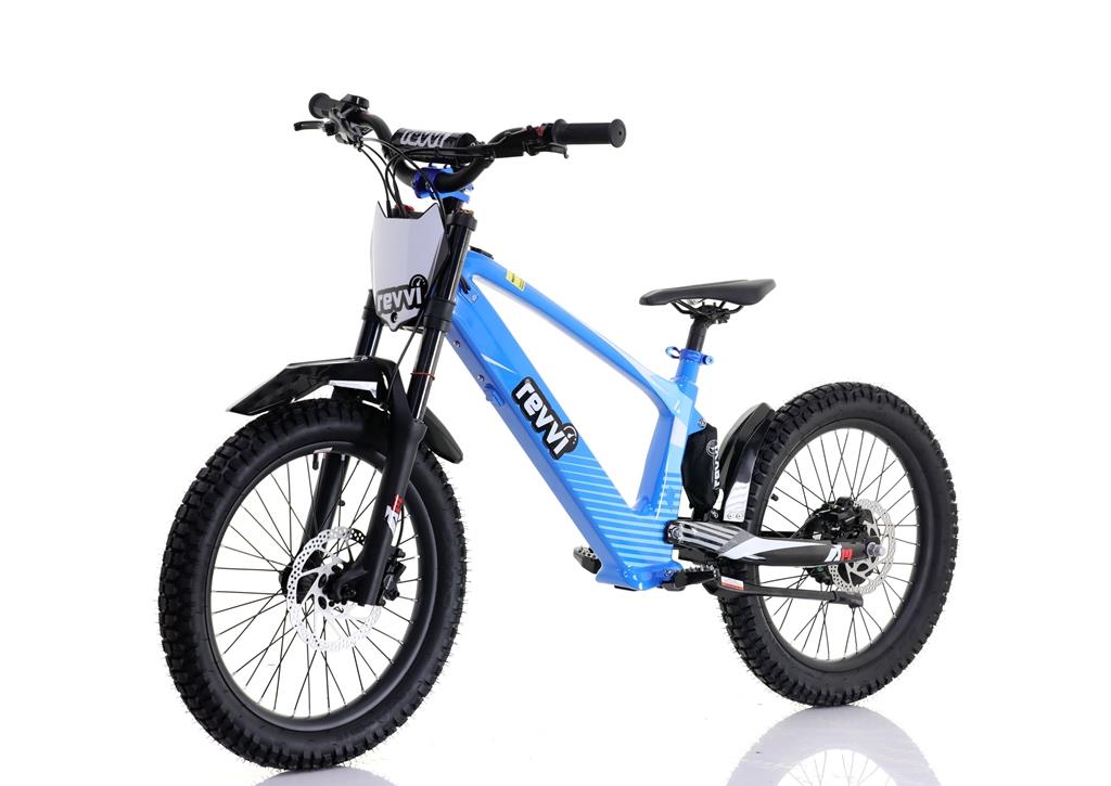 The Revvi 20" Kids Electric Balance Bike - Blue, featuring black tires and frame accents, is showcased on a white background. It has a front suspension fork, a front wheel disc brake, and displays the Revvi brand on both the frame and handlebar plate.