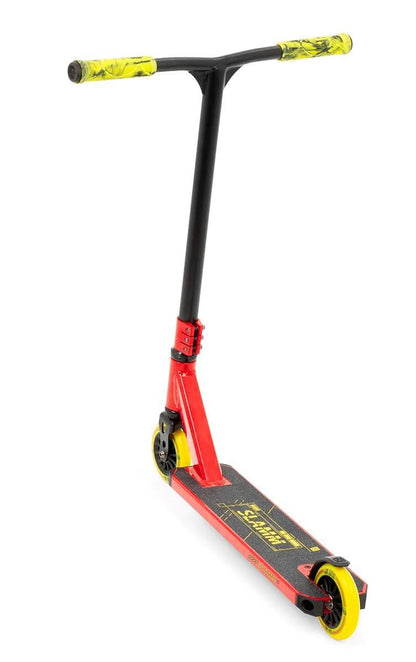 The Slamm Classic Mini Complete Stunt Scooter - Red features a bold red and black design, enhanced by yellow and black grips, along with vibrant yellow wheels. The deck showcases a striking graphic logo, making it perfect for freestyle scootering. Its minimalist aesthetic is completed with a T-shaped handlebar, making it an excellent choice for entry-level riders.