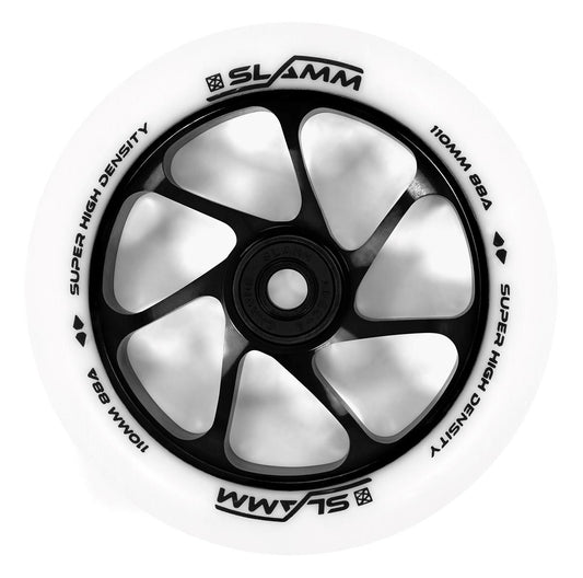 The Slamm Team 110mm Stunt Scooter Wheel, in a striking white and black color scheme, features a high-rebound PU construction. The bold black spoke pattern encircles the edge of the white tire, which is marked with "Super High Density 110mm 88A Slamm," all enhanced by a premium-grade aluminum core.