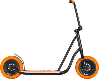 The Rocker Rolla Big Wheel Complete Scooter - Black by Rocker is designed with a T-shaped handlebar, large wheels, and a footboard. Constructed from durable Hi-Ten steel, this kick scooter features vibrant orange accents on the wheels and handle, making it ideal for extreme trick riding enthusiasts.