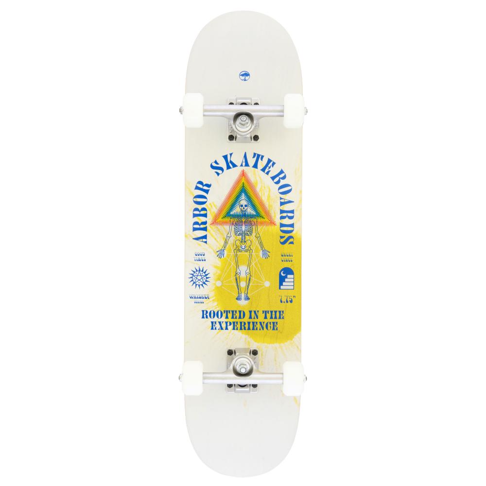 The white Arbor Whiskey Experience complete skateboard, sized at 8" x 31.75", showcases the blue "Arbor Skateboards" text, accompanied by a vibrant triangle and lines design, as well as a skeleton illustration. The phrase "Rooted in the Arbor Whiskey Experience" is displayed at the bottom.