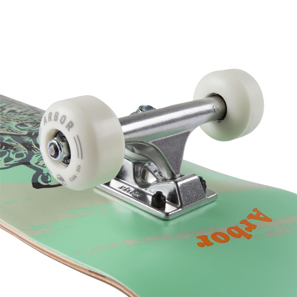 Here is a description of the Arbor skateboard:

"Close-up of the Arbor Seed Woodcut Green Complete Skateboard, designed for youth. This skateboard showcases silver trucks and white wheels on a light green deck adorned with orange text, meticulously crafted from sustainable Canadian Maple. The background is plain white.