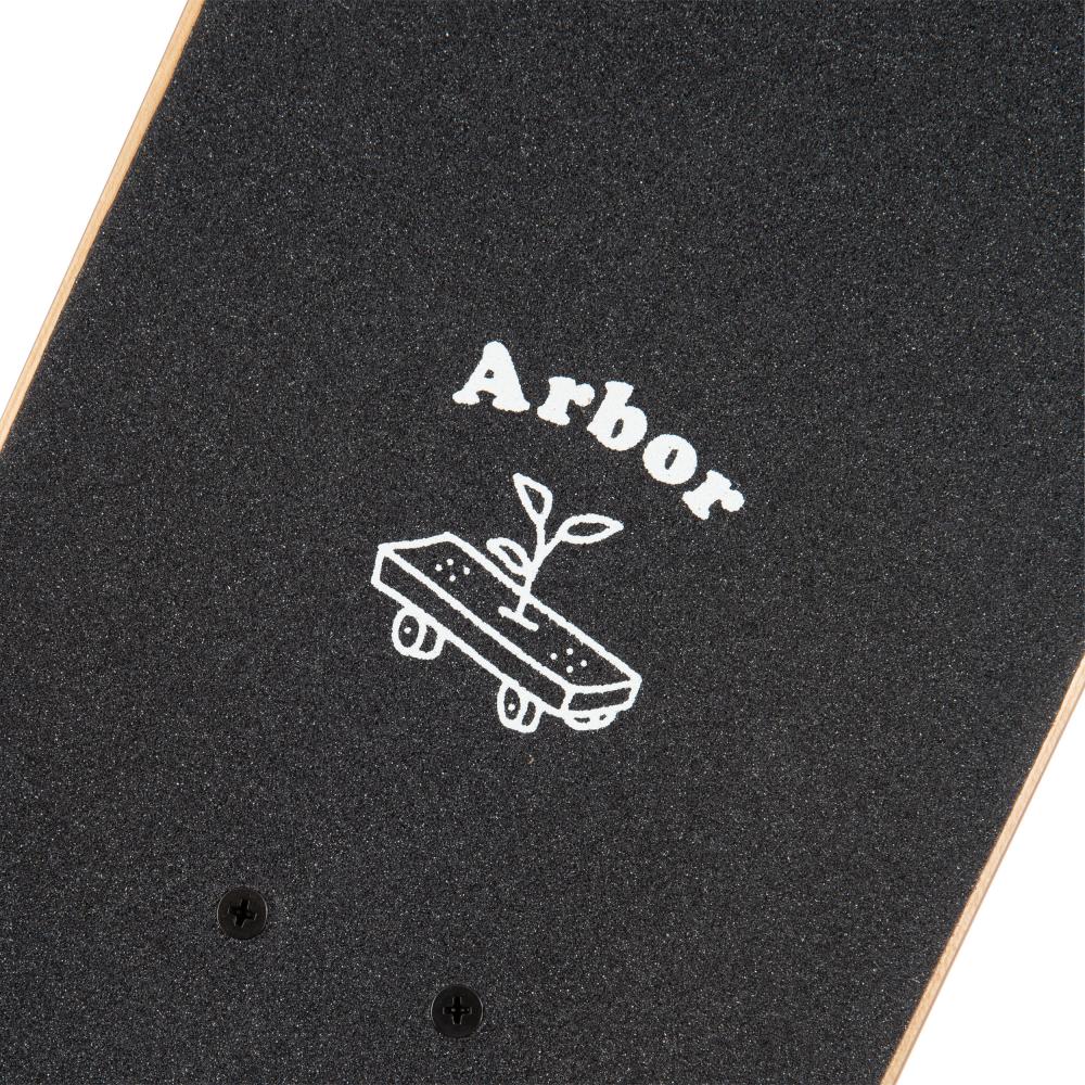 Close-up of the Arbor Seed Woodcut Green Complete Skateboard, featuring a youth deck that measures 7.25" x 28.25". The black grip tape is branded with "Arbor" and showcases a graphic of a skateboarding tree set on sustainable Canadian Maple, complemented by a sprouting plant on wheels—ideal for beginner level enthusiasts.