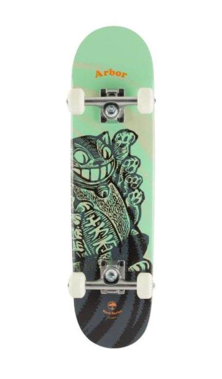 The Arbor Seed Woodcut Green Complete Skateboard - 7.25" x 28.25" is an ideal choice for beginner skaters, featuring a mint green top deck adorned with artwork of a grinning cat holding playing cards. Crafted from sustainable Canadian Maple, it prominently displays the "Arbor" brand near the top and comes equipped with robust trucks and white wheels, making it perfect for youthful enthusiasts.